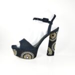 Le Silla Jewel sandal by Le Silla, Kaleido ammit black/gold model. In black canvas with a very precious stud motif on the heel and on the heel in the colors of black, gold and white. Heel height 12cm, heel height 4cm with a difference of only 8cm